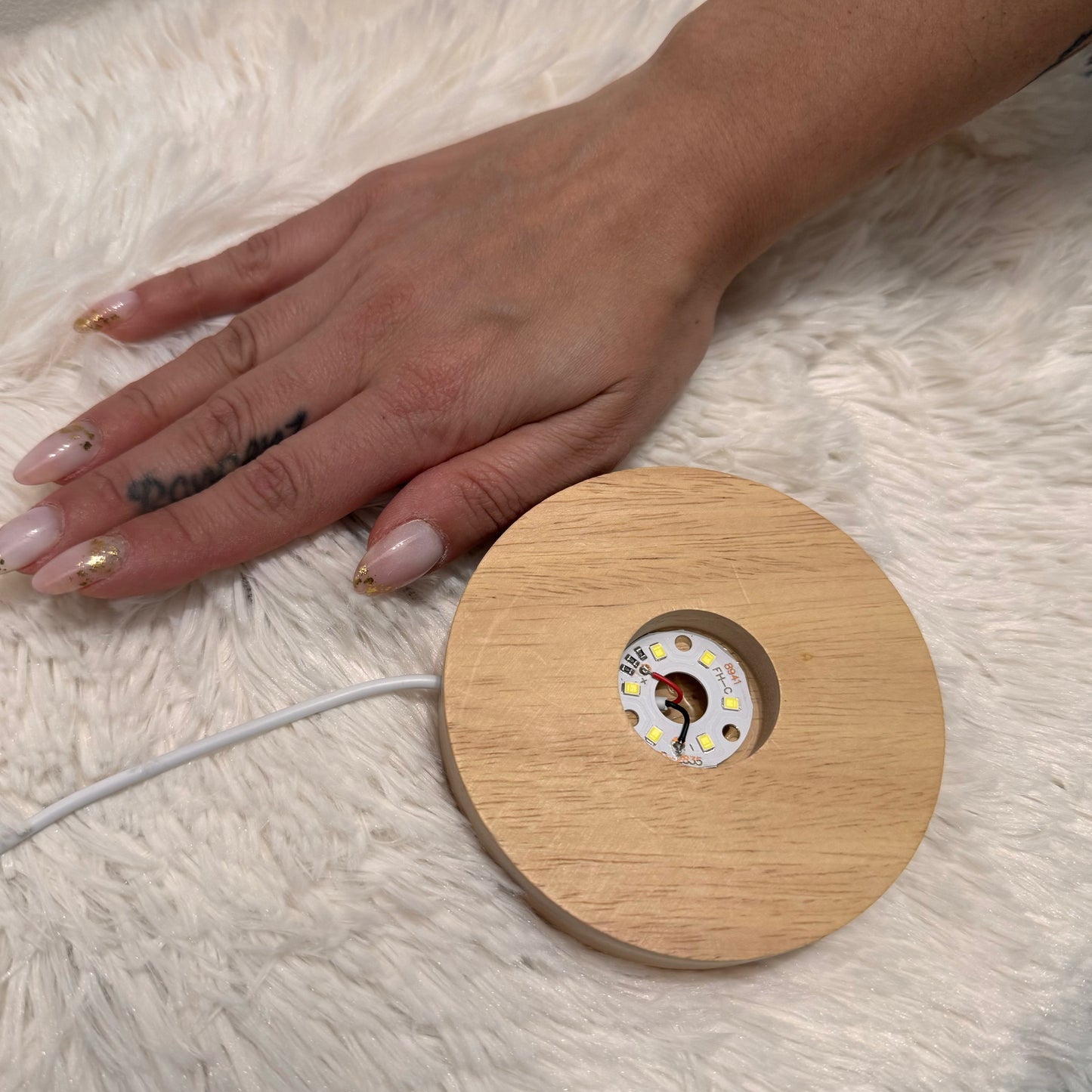 Base luminosa in legno